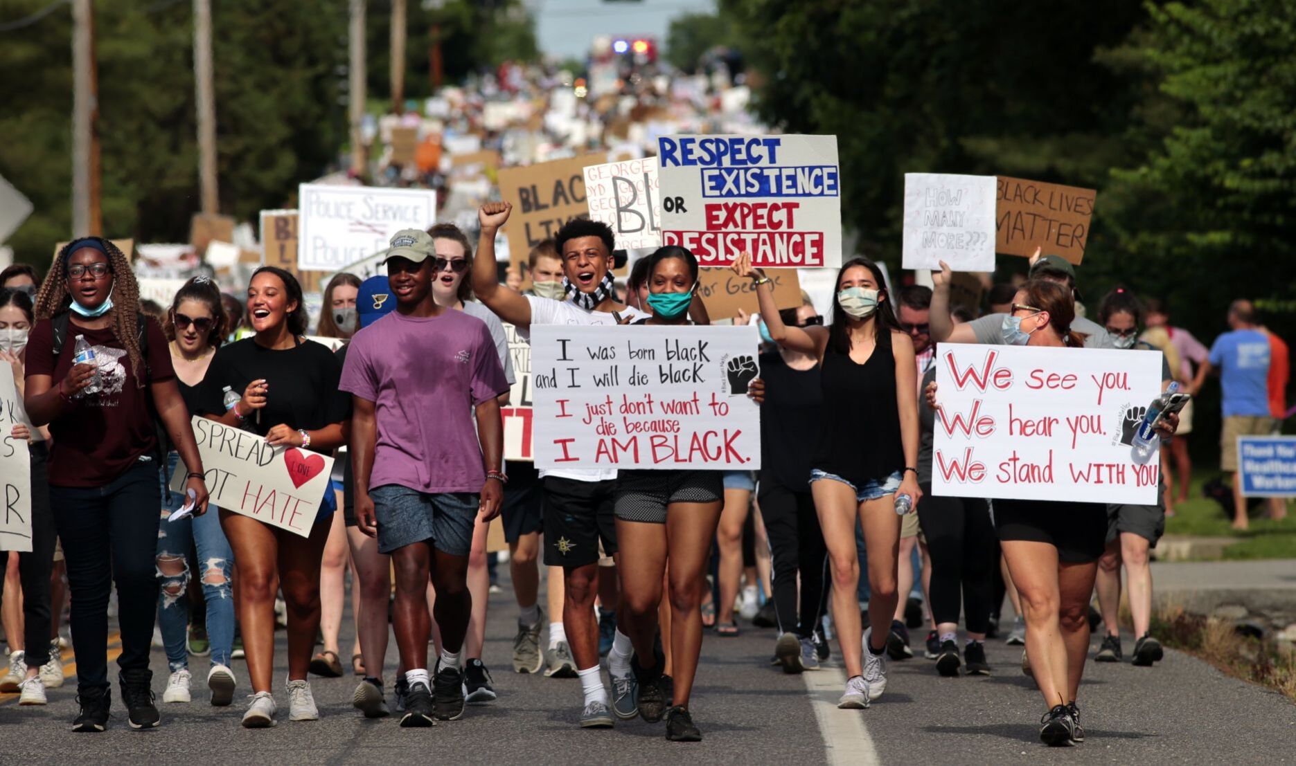 Youth march moves through wealthy suburbs